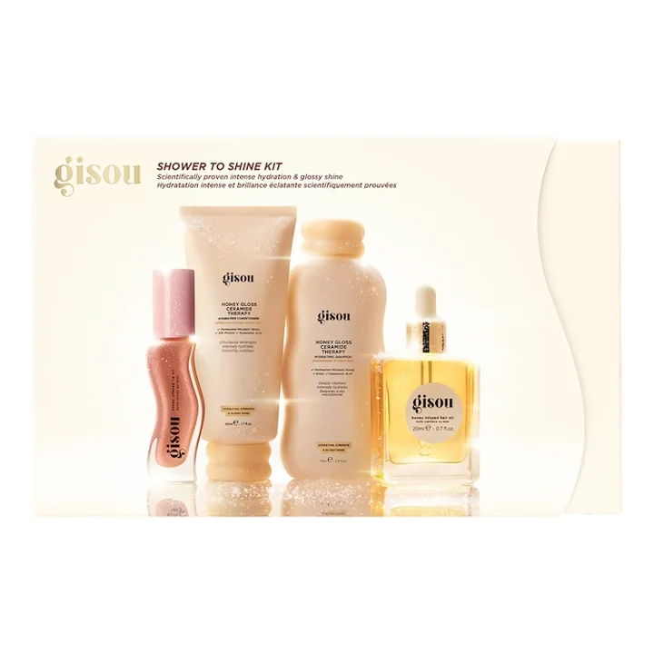 Coffret Gisou Shower To Shine com quatro produtos para cabelo e lábios.